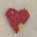 a charm of a sparkling heart emoji