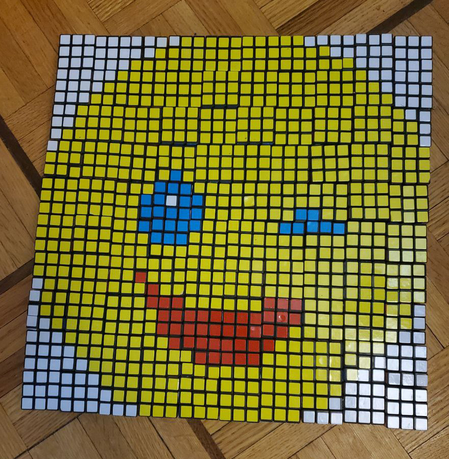A winking smiley face made out of Rubik's Cubes