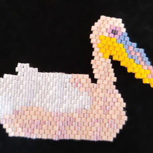 Beaded pelican in white and pink