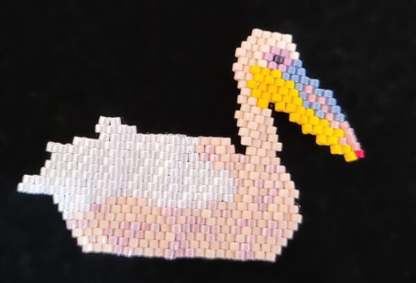 Beaded pelican in white and pink