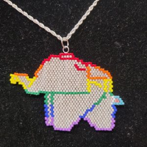 beaded elephant with the lines that mimic origami. The lines are in the pride flag colors. The tail is in the colors of the trans flag. The rest of the elephant is grey